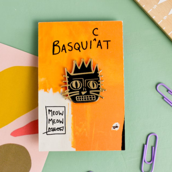 cat head enamel pin in style of Basquiat